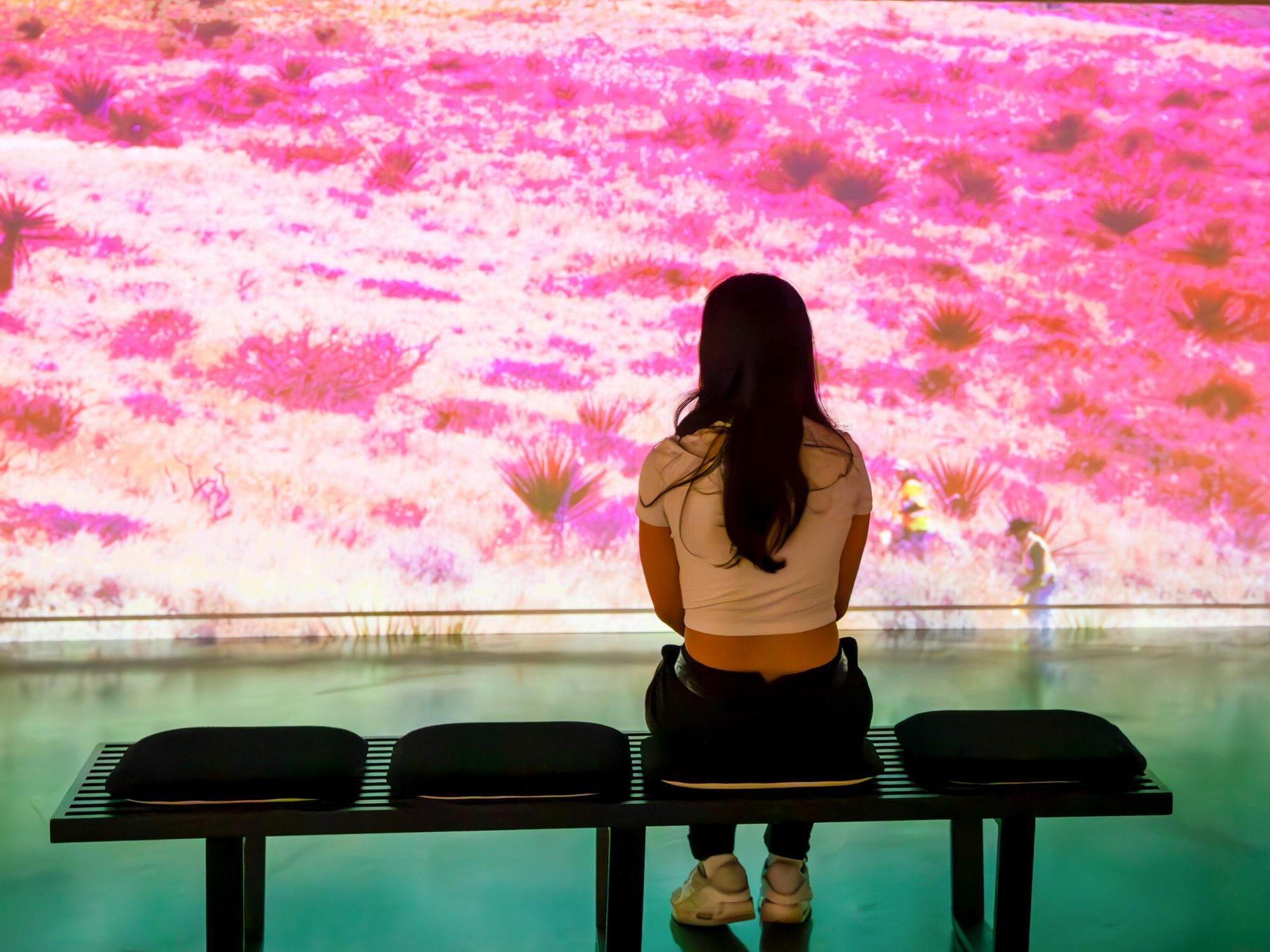 Person viewing movie in at the Institute for Arts and Sciences.